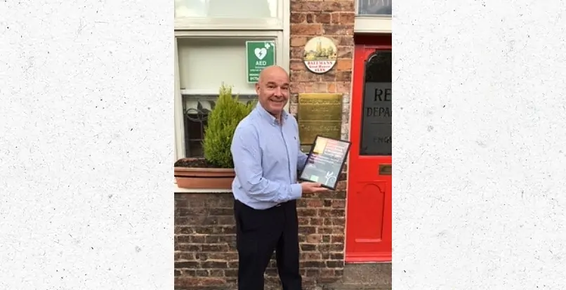 Batemans' Managing Director, Stuart Bateman holding an award