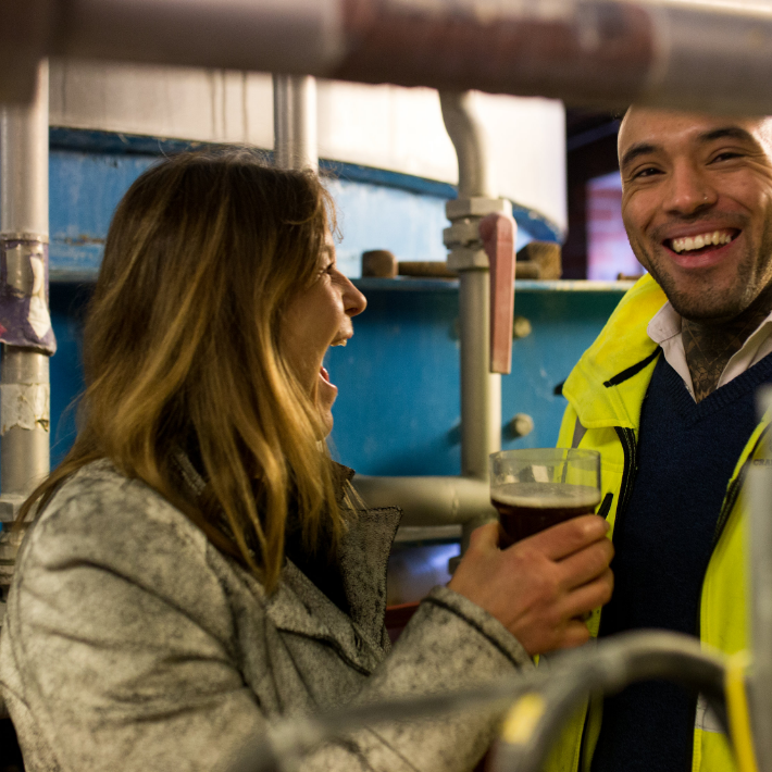 Woman and Man laughing on Brewery tour