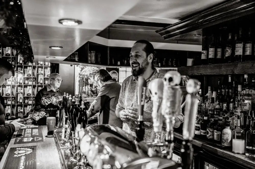 The Woolpack Louth - A man behind the bar serving