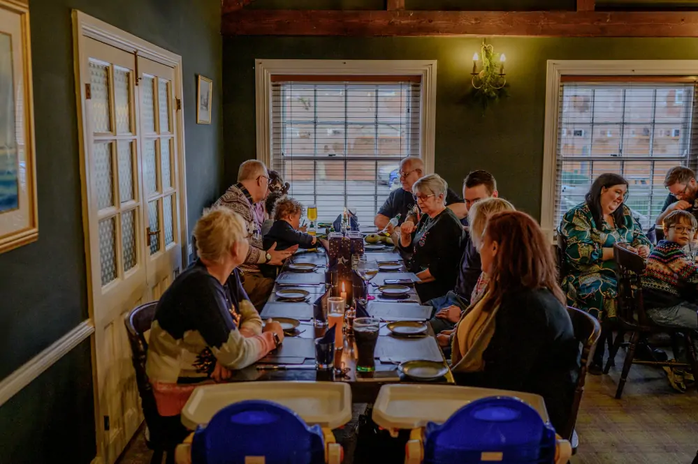 The Woolpack Louth - Group of people at Christmas waiting for food at table chatting and laughing