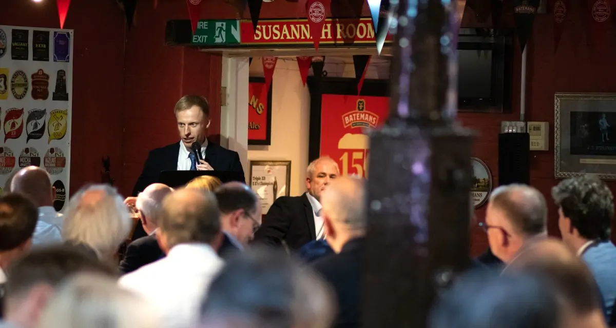 Batemans celebrate 150th anniversary with Brewers lunch - Harri Bateman with guests looking on enjoying the speeches.