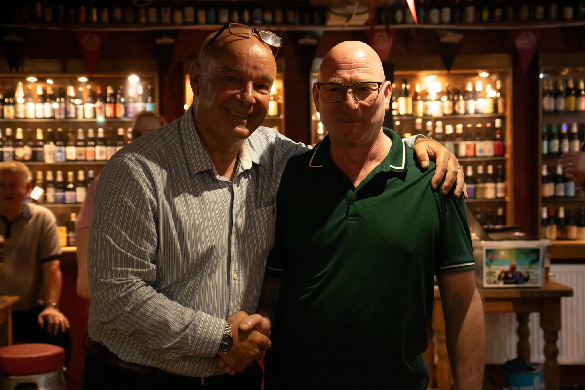 Peter Manley Pro Darts Player at the Batemans 150th anniversary celebrations darts, Stuart Bateman with one of the competitors.