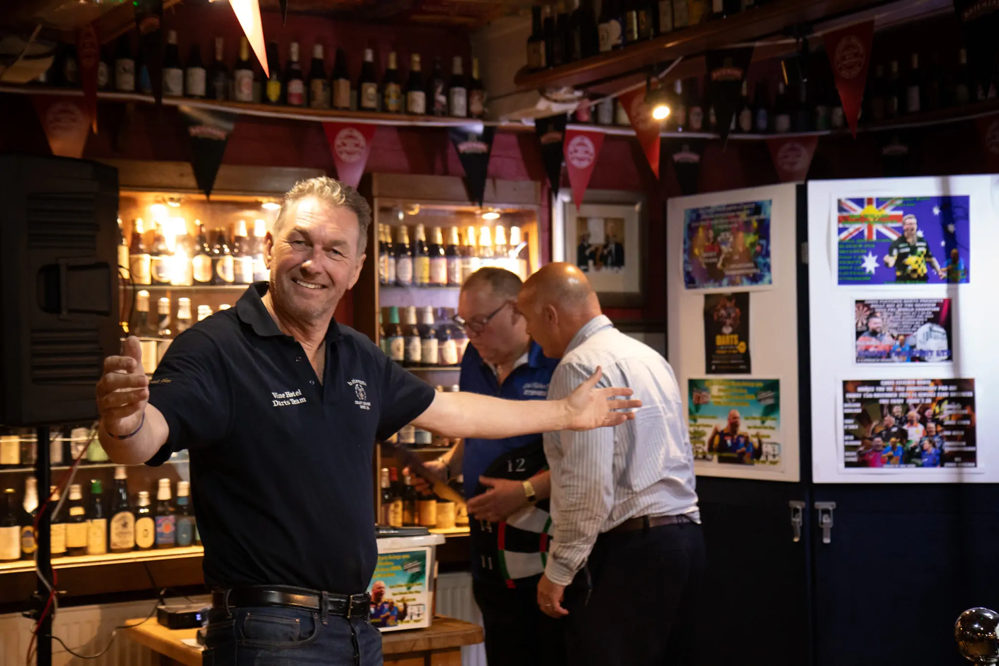 Peter Manley Pro Darts Player at the Batemans 150th anniversary celebrations darts with one of the competitors Miles Hartley.