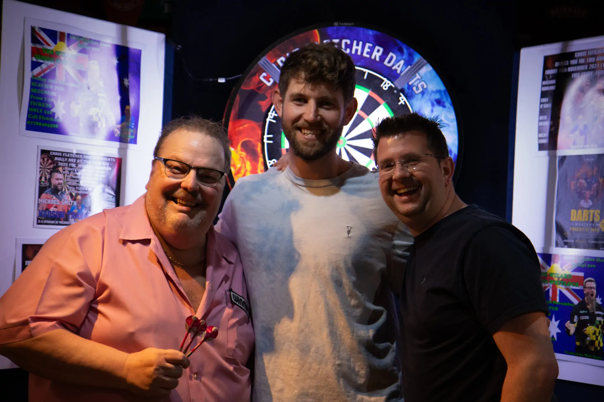Peter Manley Pro Darts Player at the Batemans 150th anniversary celebrations darts with competitors.