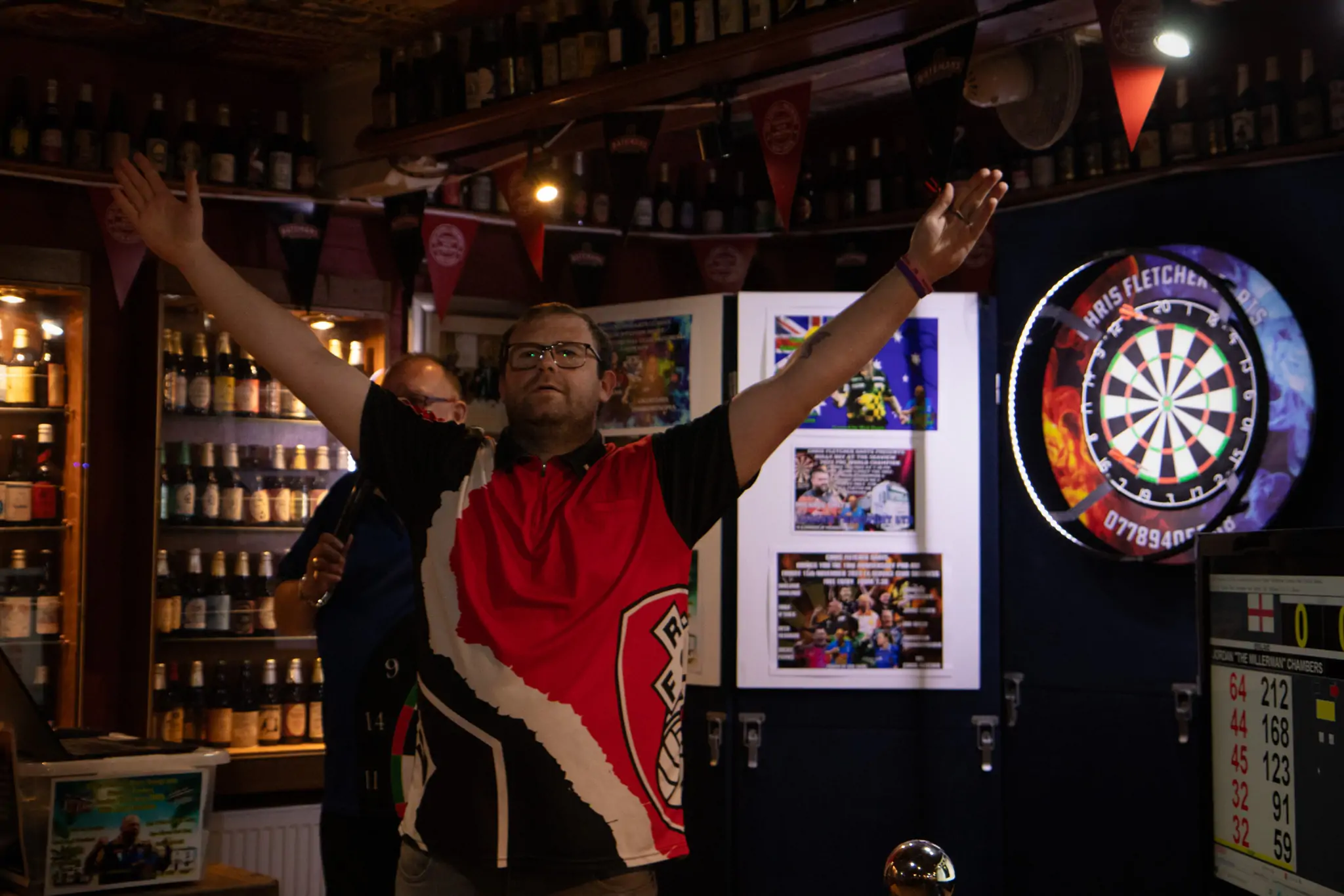 Peter Manley Pro Darts Player at the Batemans 150th anniversary celebrations darts with winner Jordan Chambers.