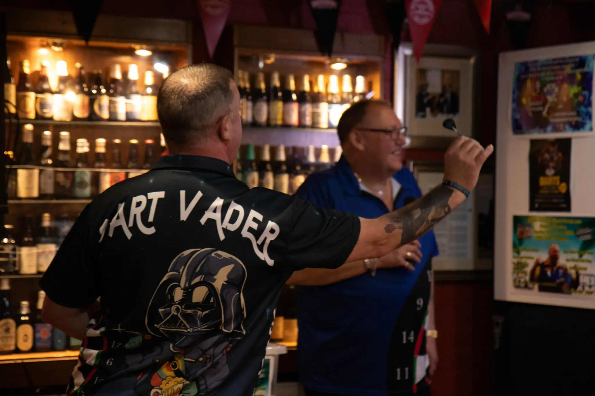 Peter Manley Pro Darts Player at the Batemans 150th anniversary celebrations darts with one of the competitors 