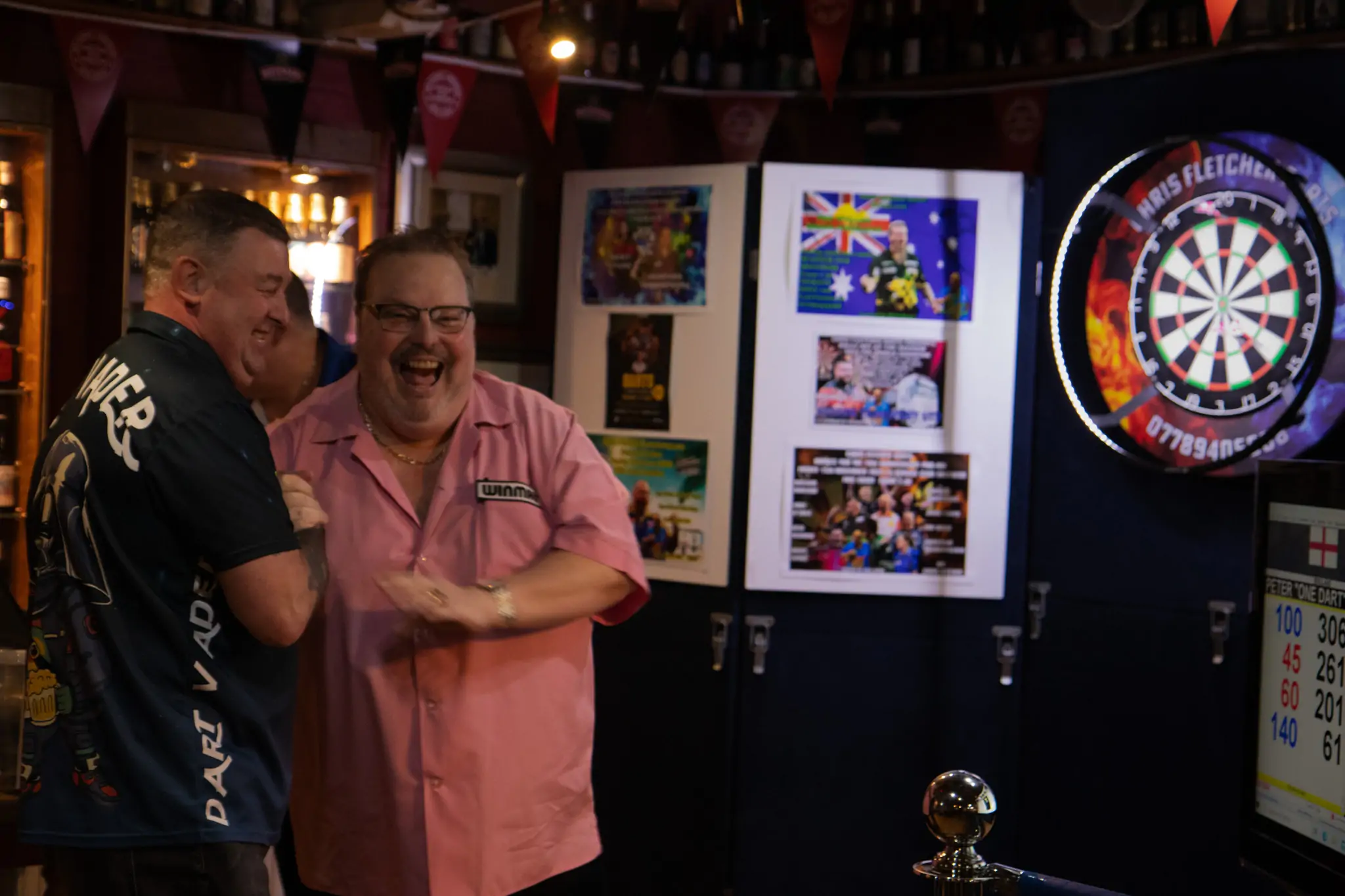 Peter Manley Pro Darts Player at the Batemans 150th anniversary celebrations darts with one of the competitors 