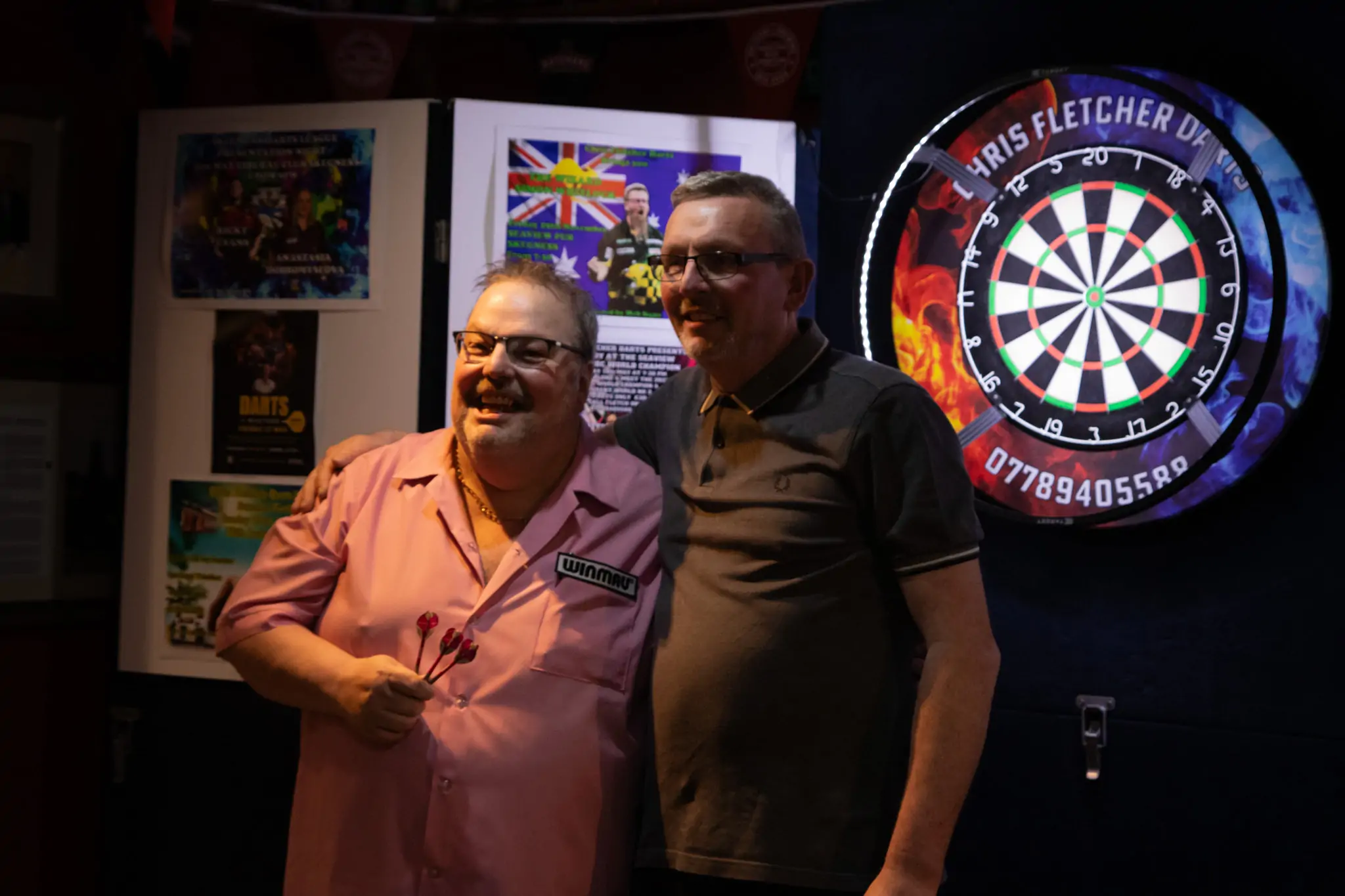 Peter Manley Pro Darts Player at the Batemans 150th anniversary celebrations darts with one of the competitors Martin Bell.