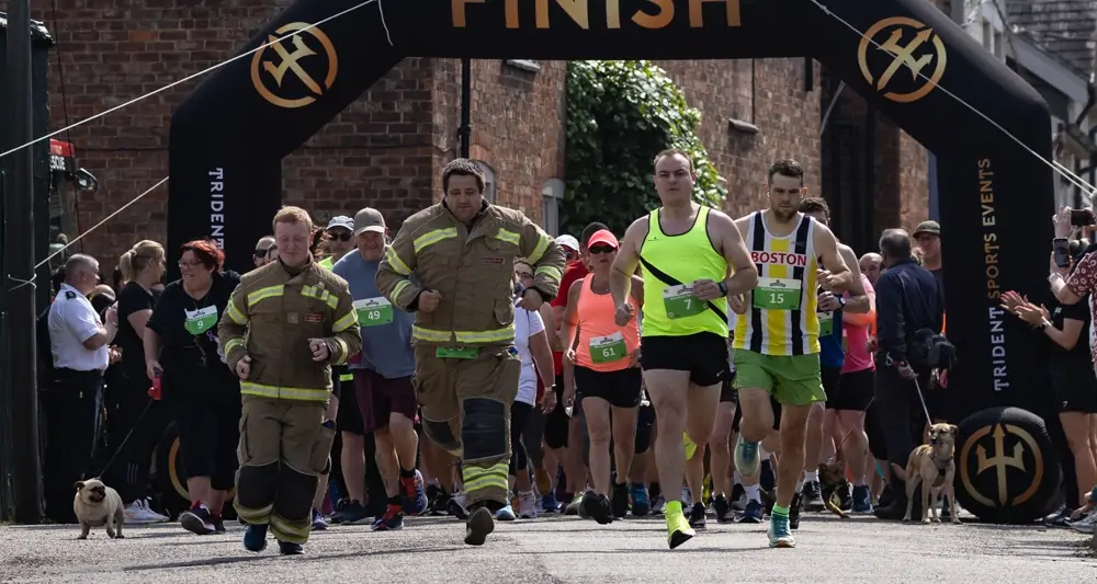 Five Generations Charity Fun Run - Runners setting off with Firefighters in full uniform at the front