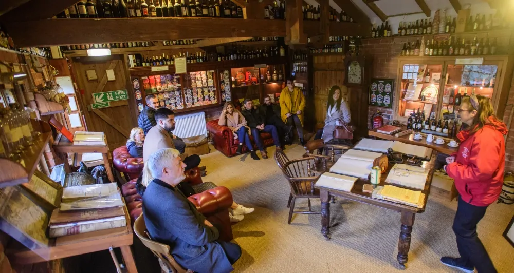 Batemans Brewery Tour - Group in Archive Room for History of Batemans Talk